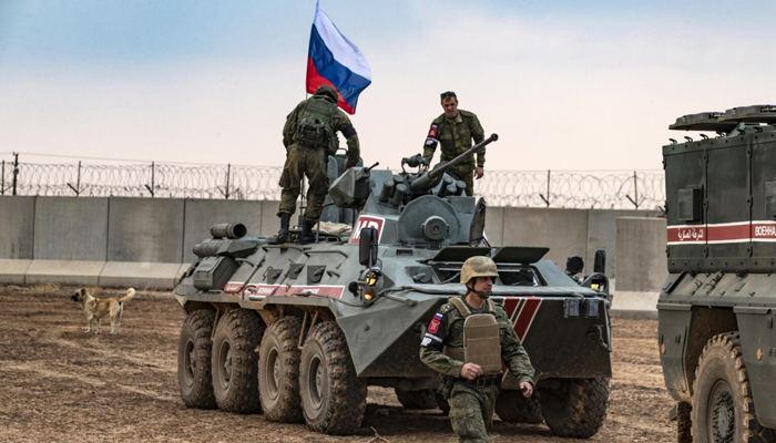 Russian troops with military vehicles are seen on patrol. — AFP/File