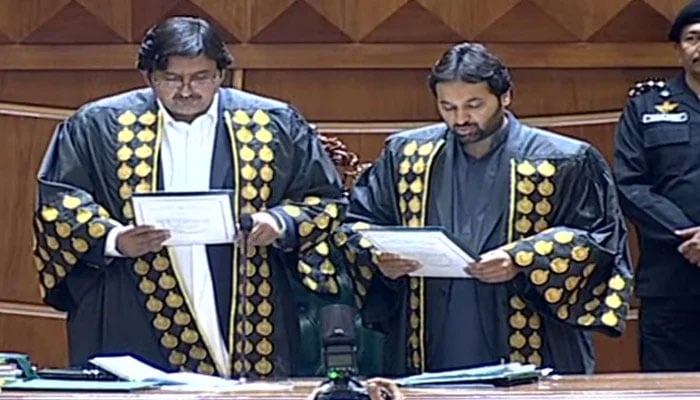 Punjab Assembly Speaker Malik Ahmed Khan administers the oath to newly-elected deputy speaker Malik Zaheer Iqbal on February 24, 2024. — Geo News/Screengrab