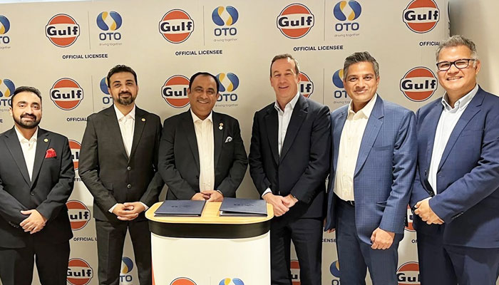 Officials from Gulf Oil and OTO Pakistan gesture for a group photo after signing a partnership agreement between the two companies in the UK on February 16, 2024. — Facebook/OTO Pakistan