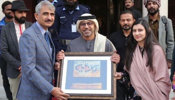 In this image, the exhibition officer of Lahore Museum Ms Arshia Sohail, and the deputy director of Lahore Museum present a souvenir to the Ambassador of the United Arab Emirates (UAE) Hamad Obaid Ibrahim Salem Al-Zaabi on February 24, 2024. — DNA