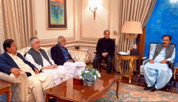 The screenshot shows  Prime Minister-designate Shehbaz Sharif meeting newly-elected members of National and provincial assemblies from Balochistan on Feb 24, 2024. — Facebook/ShehbazSharif