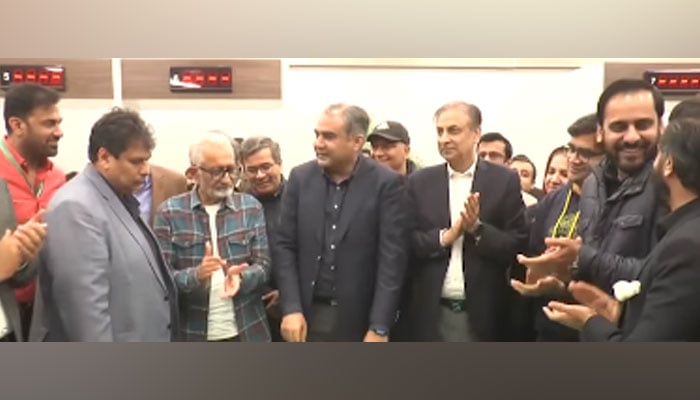 This screengrab shows caretaker Chief Minister Mohsin Naqvi cuts the cake during inauguration ceremony of the New Lab and Collection Centre On February 25, 2024. — Facebook/Govt of Punjab