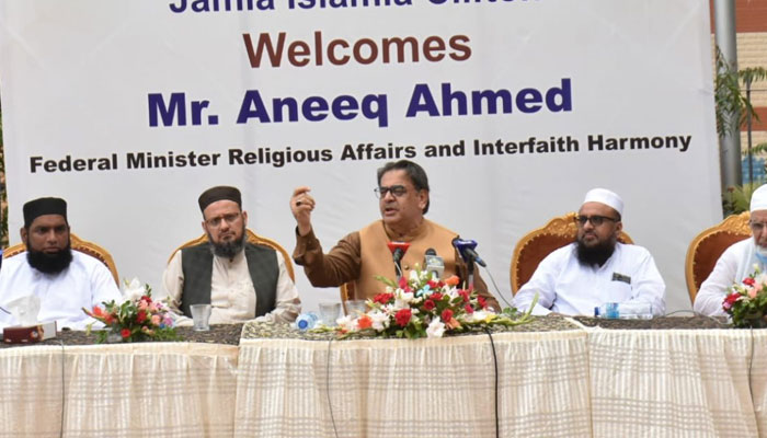 Federal caretaker religious affairs and interfaith harmony minister Aneeq Ahmed Addresses the religious scholars. — APP/File