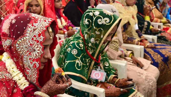 Brides attend a mass Islamic marriage ceremony organized by the Gujarat Sarvajanik Welfare Trust in Ahmedabad on 4 February 2024. — AFP