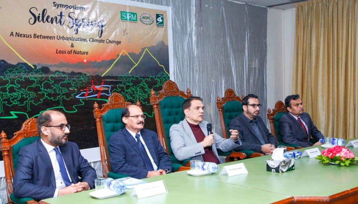 This image shows A Panel of five interacting with the audience at the event of  collaboration between the Institute of Rural Management (IRM), and National Cleaner Production Center (NCPC), and the Department of Environmental Sciences at Fatima Jinnah Women University, Rawalpindi on February 26, 2024. — APP