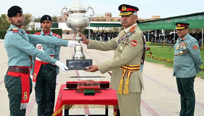 Corps Commander Karachi, Lieutenant General Babar Iftikhar distributes Trophy and Awards to the best candidates during the 31st passing out Parade ceremony held at Rangers Training Center and School in Karachi on February 26, 2024. PPI