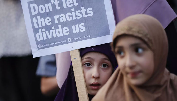 This representational image shows the children holding a protest placard. — AFP/File
