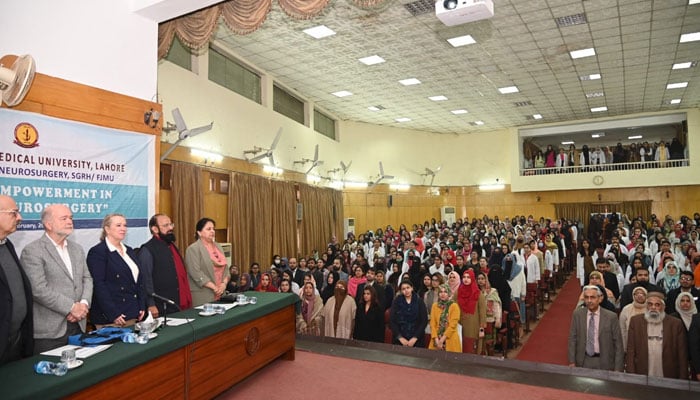 University officials and students stands for national anthem during an international seminar at FJMU on February 27, 2024. — Facebook/Fatima Jinnah Medical University