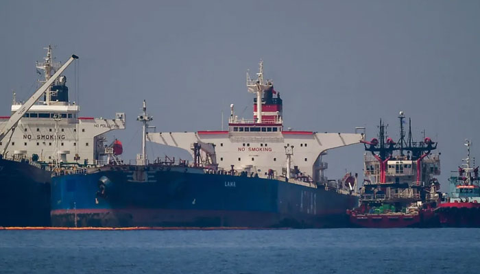 The Liberian-flagged oil tanker Ice Energy (left) transfers crude oil from the Russian-flagged oil tanker Lana (right), off the coast of Greece, on May 29, 2022. — AFP