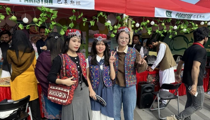 This image shows chines women wears Pakistani dress. — APP/File