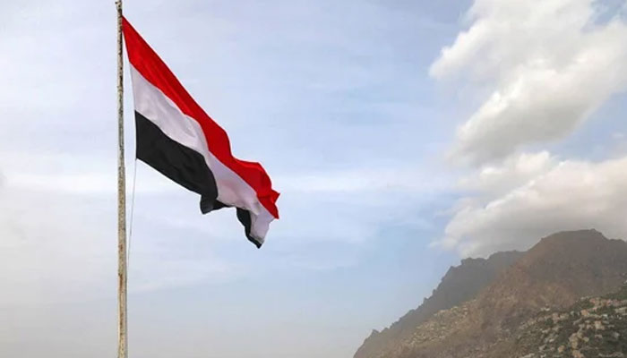 A Yemeni flag waves in the city of Taez. — AFP/File