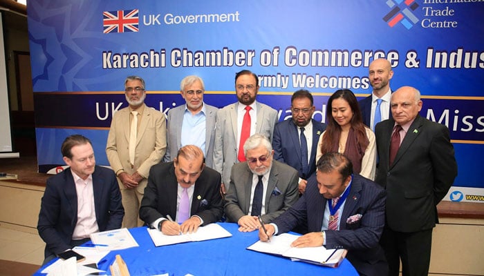 President KCCI Iftikhar Ahmed Sheikh and President Greater Birmingham Chamber of Commerce Nasir Awan can be seen signing a Memorandum of Understanding (MoU) On the occasion of the Karachi, Birmingham Chambers ink deal. — Facebook/Karachi Chamber of Commerce & Industry