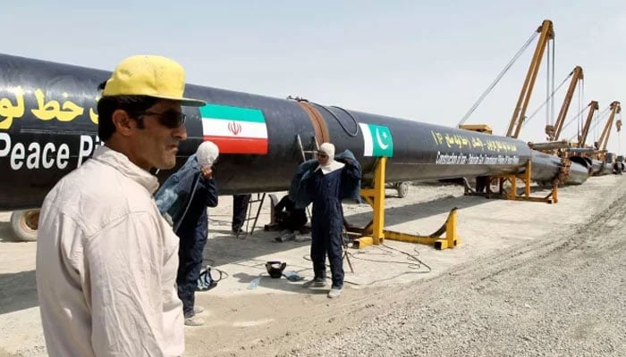 Iranian workers are seen working on the Pak-Iran gas pipeline project. — AFP/File