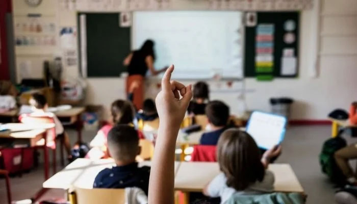 A classroom with a teacher and students. — AFP File