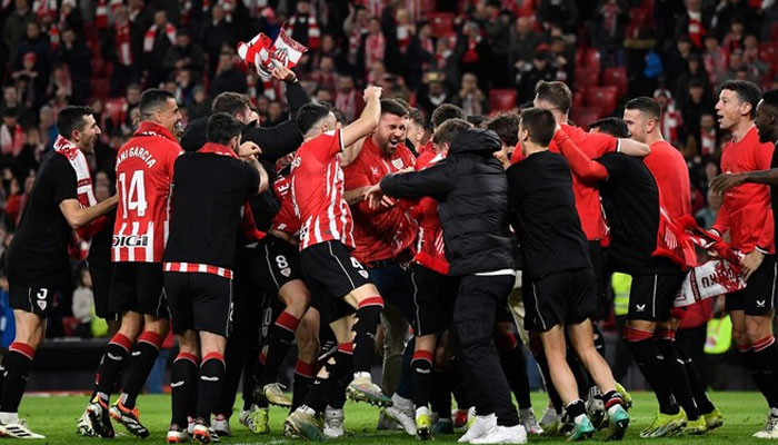 Athletic Bilbao players celebrate their victory at the end of the Spanish Copa del Rey (Kings Cup) semifinal second leg between Athletic Club Bilbao and Club Atletico de Madrid at the San Mames stadium in Bilbao on Feb. 29, 2024. — AFP