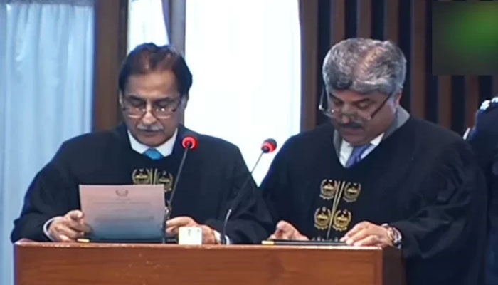 NA Speaker Ayaz Sadiq (left) administers oath to NAs newly elected Deputy Speaker Syed Ghulam Mustafa Shah in the lower houses session in Islamabad, on March 1, 2024, in this still taken from a video. — YouTube/@PTVParliament