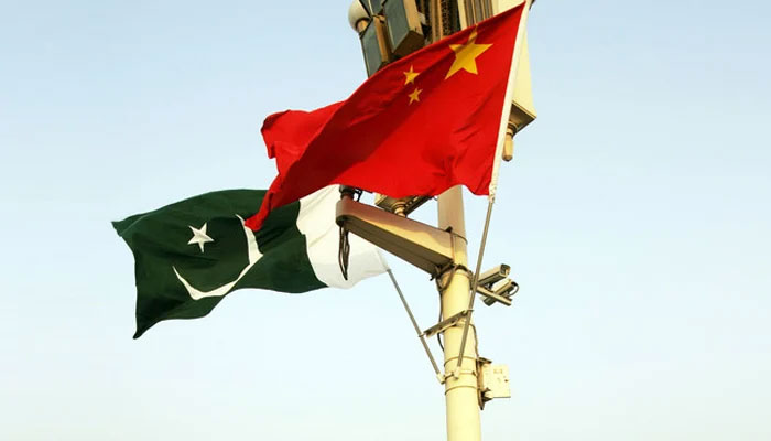 A representational image showing the flags of Pakistan and China. — AFP/File