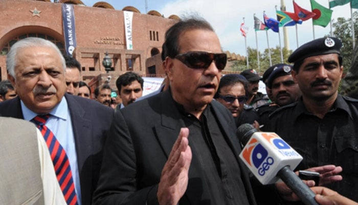Former Punjab governor Salmaan Taseer (late) speaks to media persons outside the PCB office. — AFP/File