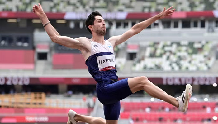 Greeces Miltiadis Tentoglou reacts as he attempts a long jump in this undated picture. — AFP/File