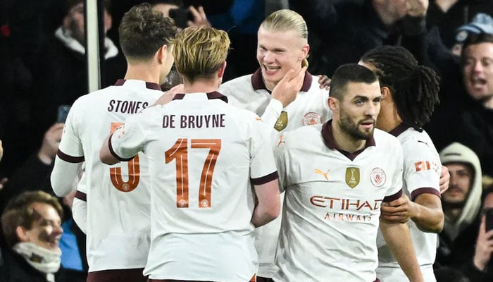Manchester City’s Erling Braut Haaland celebrating with teammates. — AFP/File