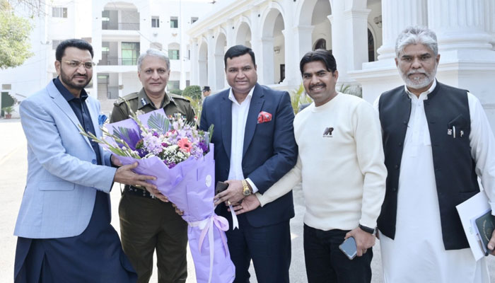 IG Punjab Dr. Usman Anwar (2nd L) present flower bouquet to Federal Minister for Human Rights Khalil George while other officials were also present during visit to Central Police Office on March 2, 2024. —Facebook/Punjab Police Pakistan