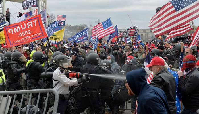 In this image, Trump supporters clash with police and security forces as they try to storm the US Capitol on January 6, 2021. — AFP