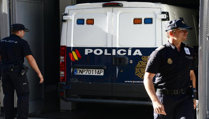 Spanish police officials can be seen in this image. — AFP/File