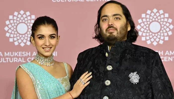 Asias richest man Mukesh Ambanis son Anant Ambani (right) poses with his fiancee Radhika Merchant. — AFP/File