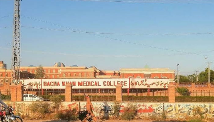 A man passes through outside the Bacha Khan Medical College on April 17, 2023. — Facebook/Bacha Khan Medical College BKMC Mardan