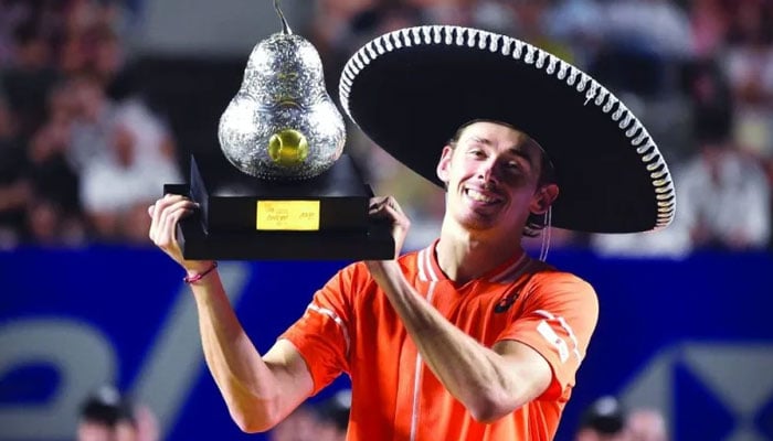 Australia’s Alex De Minaur celebrates with his trophy after winning the Mexico Open at the Arena GNP Seguros in Acapulco, Mexico. — AFP/File