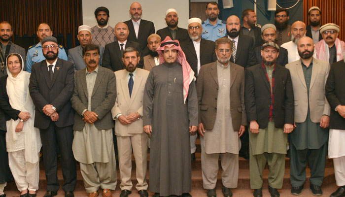 Participants of the course pose for a picture during a ceremony at the Faisal Masjid on March 1, 2024. — Facebook/International Islamic University, Islamabad (IIUI)