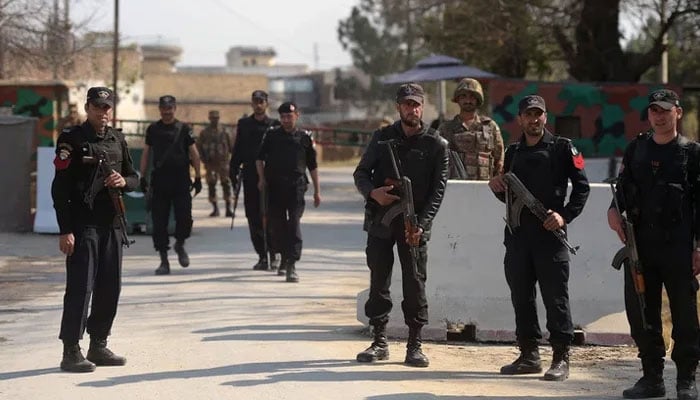 KP security personnel stand guard at an undisclosed locationin Mardan. — AFP/File