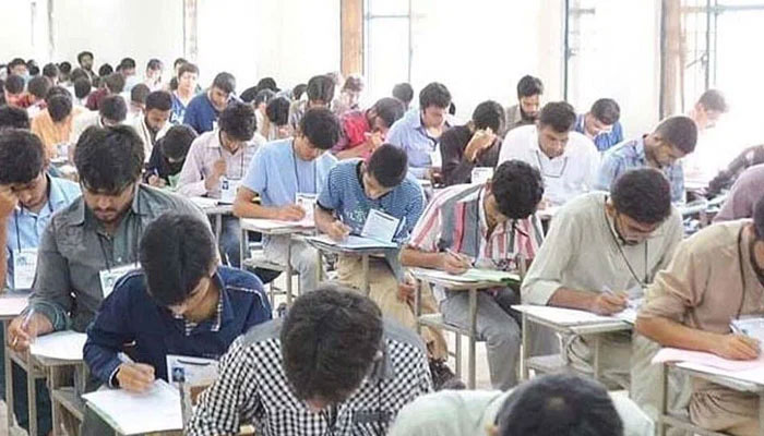 A photograph of students appearing in matriculation exam. — APP/File