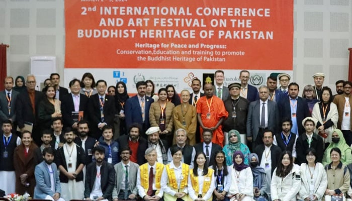 Participants pose during the 2nd International Buddhist Conference and Art Festival organised by the Taxila Institute of Asian Civilizations, Quaid-i-Azam University (QAU) on March 3, 2024. — Facebook/Quaid-i-Azam University,Islamabad