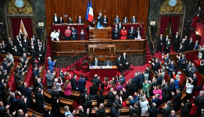 French lawmakers applaud after President of the National Assembly Yael Braun-Pivet announced the result of the vote to anchor the right to abortion in the countrys constitution on March 4, 2024. — AFP