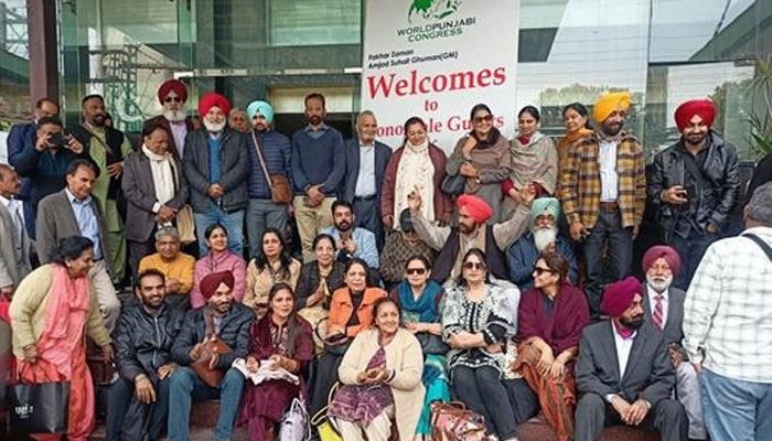 Participants pose at World Punjabi Conference. — APP/File
