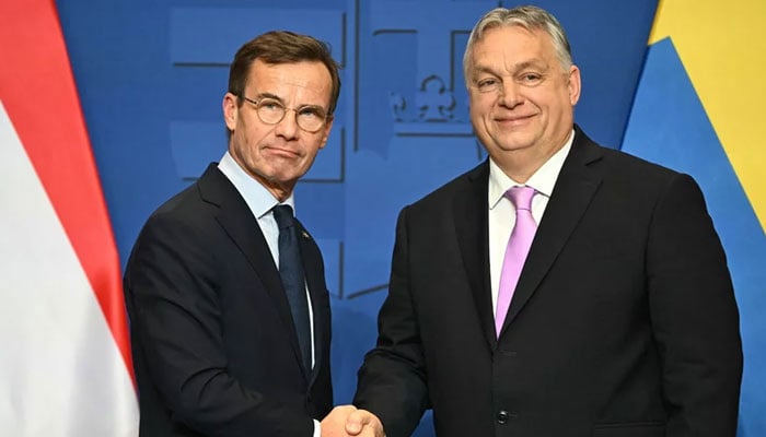 Swedish Prime Minister Ulf Kristersson (left) meets Hungarian Prime Minister Viktor Orban on February 23, 2024. — AFP
