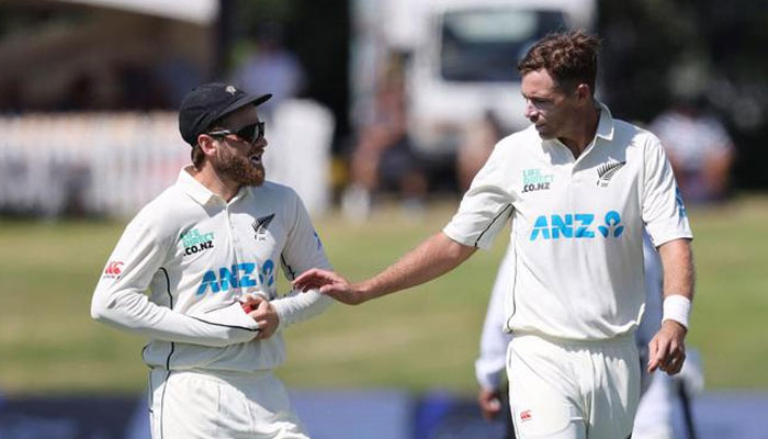 New Zealand cricketers Kane Williamson (L) and Tim Southee talk during the Test match. — AFP/File