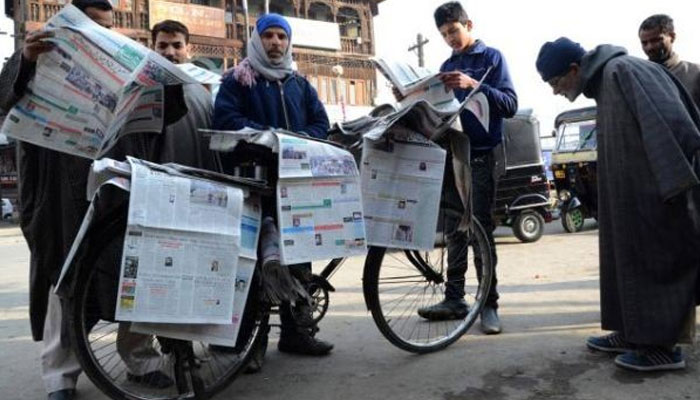 Representational image of a man selling newspapers in Kashmir. — KL