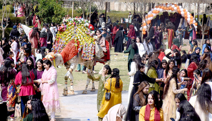 Students enjoy camel ride during Annual Funfair at Model College G10/4 on March 6, 2024. — APP