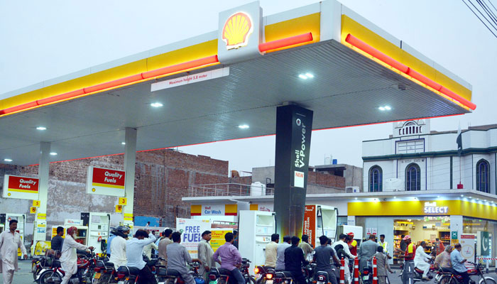 A view of a Shell petrol pump with bikers waiting at the fuel station. — Online/File
