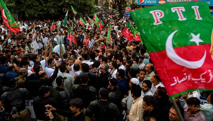 Activists of PTI protest on a street against the disqualification decision of former prime minister Imran Khan in Karachi. — AFP/File