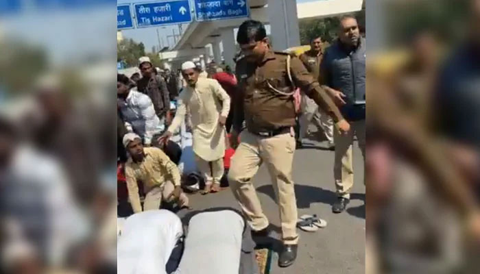 New Delhi police officer kicking a Muslim offering Nawaz in this still taken from a video on March 8, 2024. — X/ @AshfaqueNabi