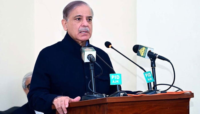 Prime Minister, Muhammad Shehbaz Sharif talks to the affectees of torrential rains and heavy snowfall, in Muzaffarabad on March 8, 2024. — PPI