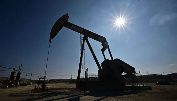 A working oil pumpjack in Taft Kern County California US September 21, 2023. — AFP