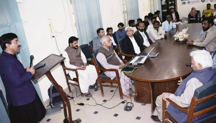 A participant speaks at a one-day training program for farmers at the crop production facility of the Sindh Agriculture University (SAU) on March 9, 2024. — Facebook/Sindh Agriculture University, Tandojam- Official