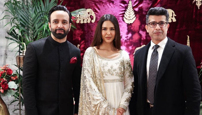 (From left to right) Mohsin Naveed Ranjha, Sonam Bajwa and Malik Asad pose for a photo at the launch of MNR design studio in London, UK. — Reporter