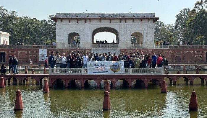 People pose for a photo at a photo walk in Shalimar Garden on March 9, 2024. — Facebook/Punjab Walled Cities Authority
