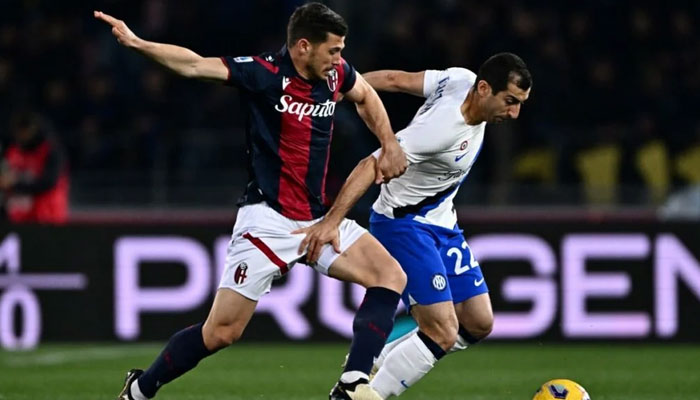 Bologna’s Nicolas Dominguez (left) and Inter Milan’s Henrikh Mkhitaryan vie for the ball in the teams’ Serie A match on March 9, 2024. — AFP