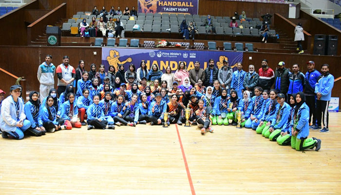 Participants pose along at the closing ceremony of the Prime Minister’s Youth Talent Hunt Sports Handball (Women) Federal League on March 8, 2024. — Facebook/International Islamic University, Islamabad (IIUI)